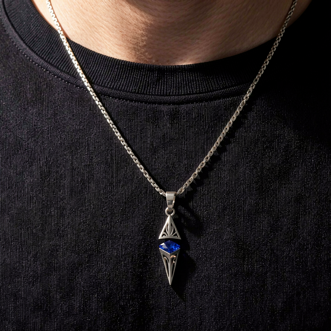 Axis Cobalt necklace layered over a black crew-neck shirt