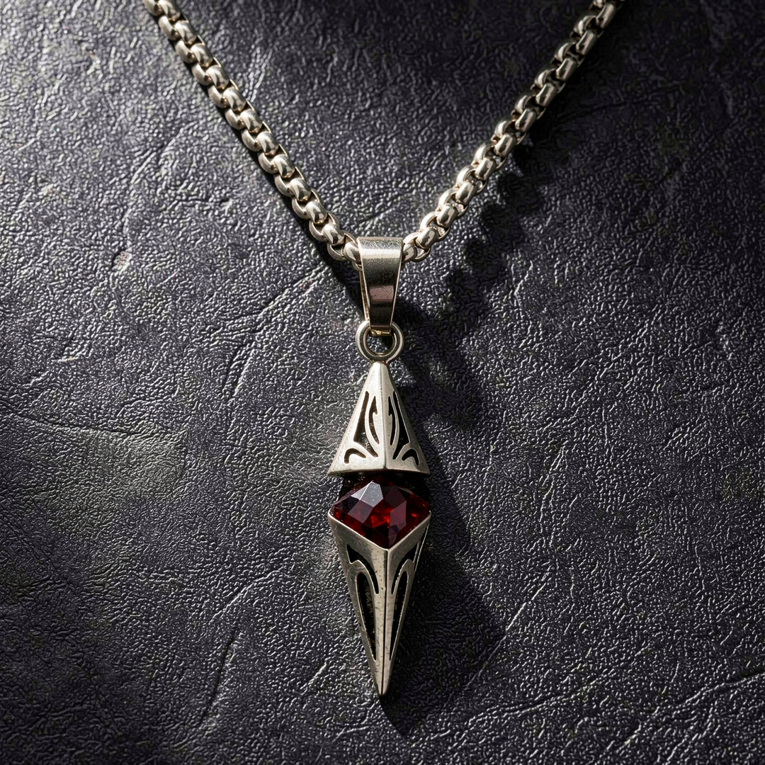 Axis Ruby necklace laid on textured black leather