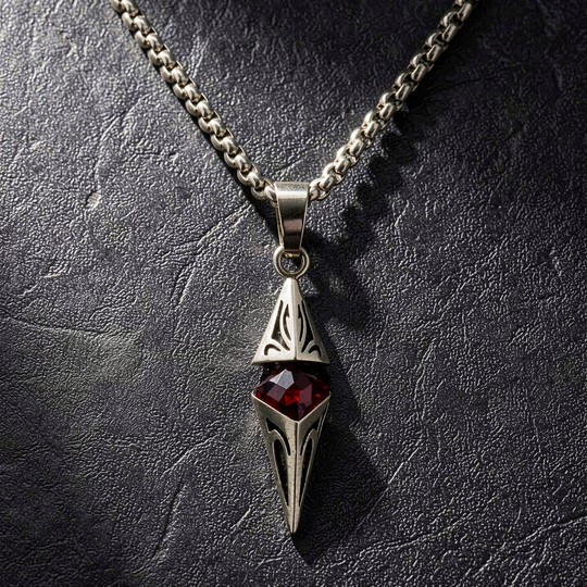 Axis Ruby necklace laid on textured black leather
