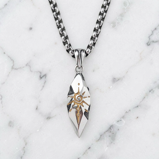 Sigil Quicksilver necklace arranged on white marble