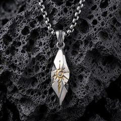 Sigil Quicksilver pendant arranged on porous black stone