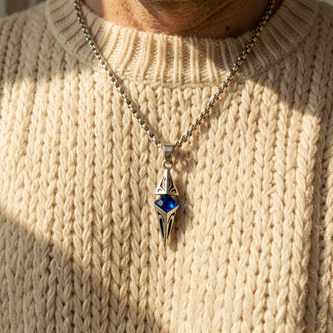Axis Cobalt necklace layered over a cream knit