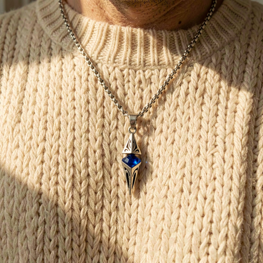 Axis Cobalt necklace layered over a cream knit