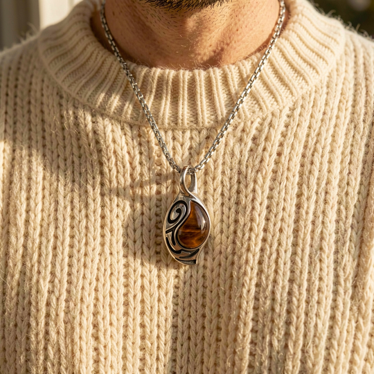 Vortex Ember necklace layered over a cream knit