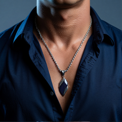 Nebula necklace worn with a deep blue open-collar shirt