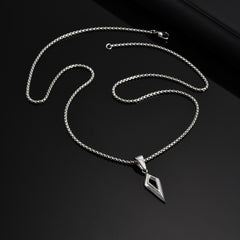 Full Shard necklace and clasp arranged on a black surface
