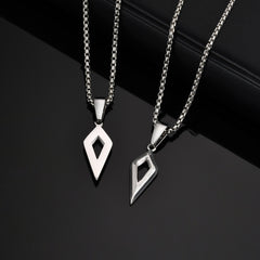 Front and angled views of the Shard silver open diamond pendant on black
