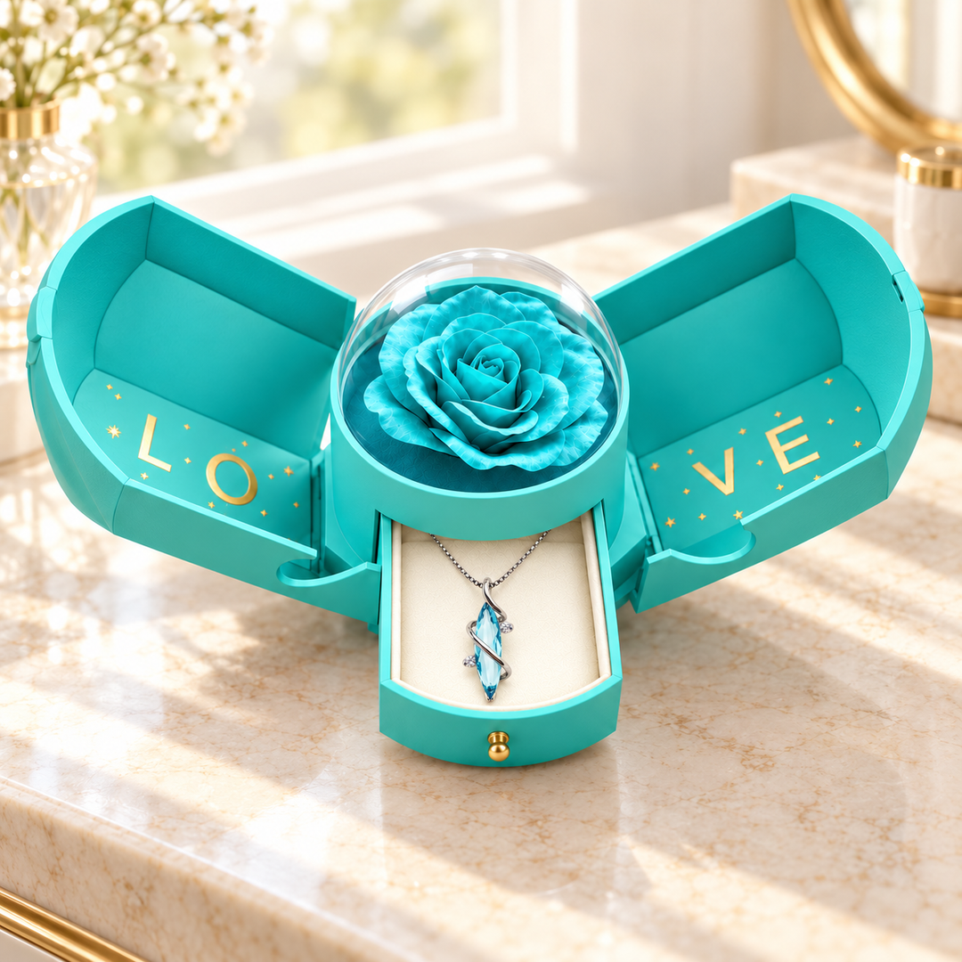 Open light blue Rose Box with its flower under the clear plastic dome and Aethera Frost in the drawer