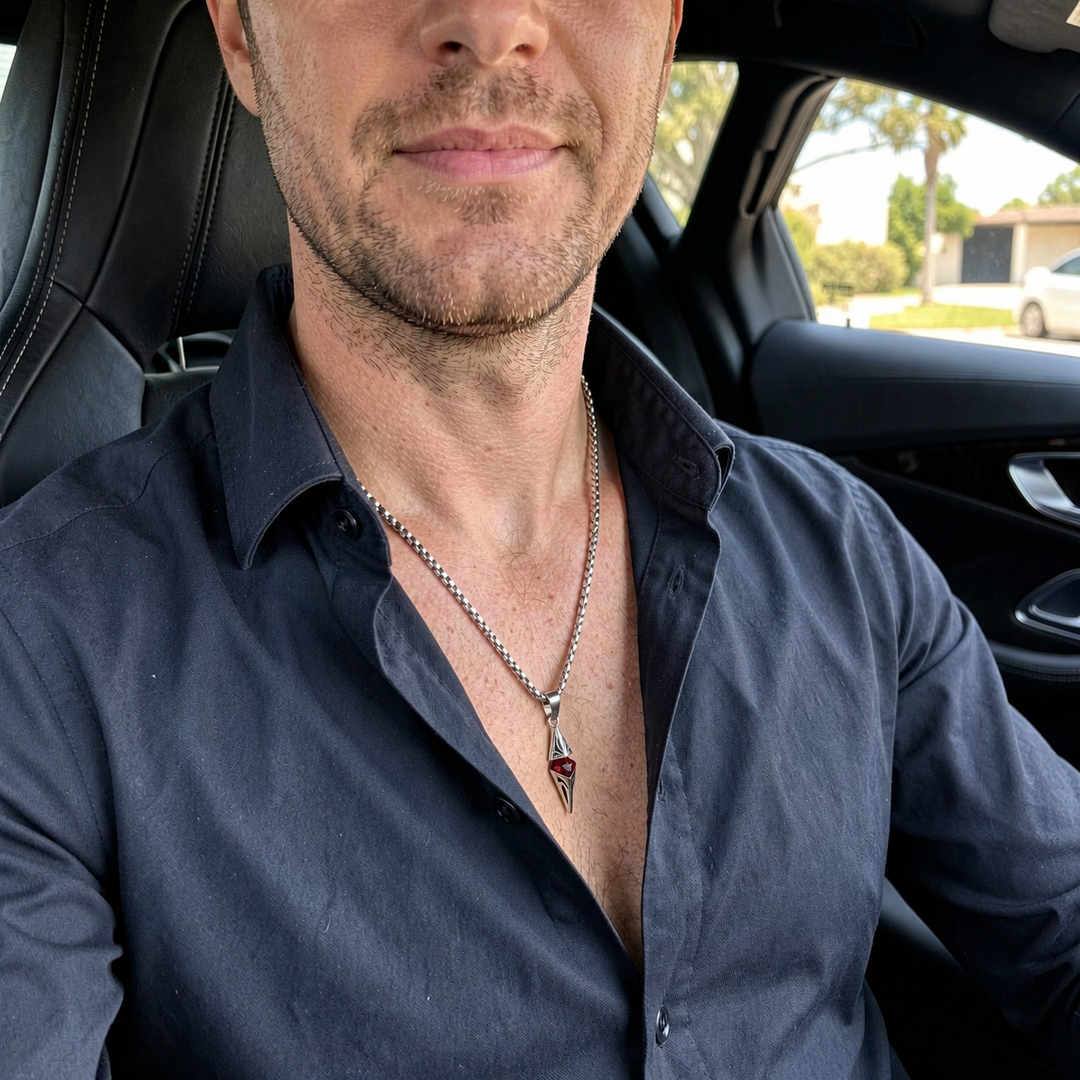 Axis Ruby necklace worn with a dark open-collar shirt