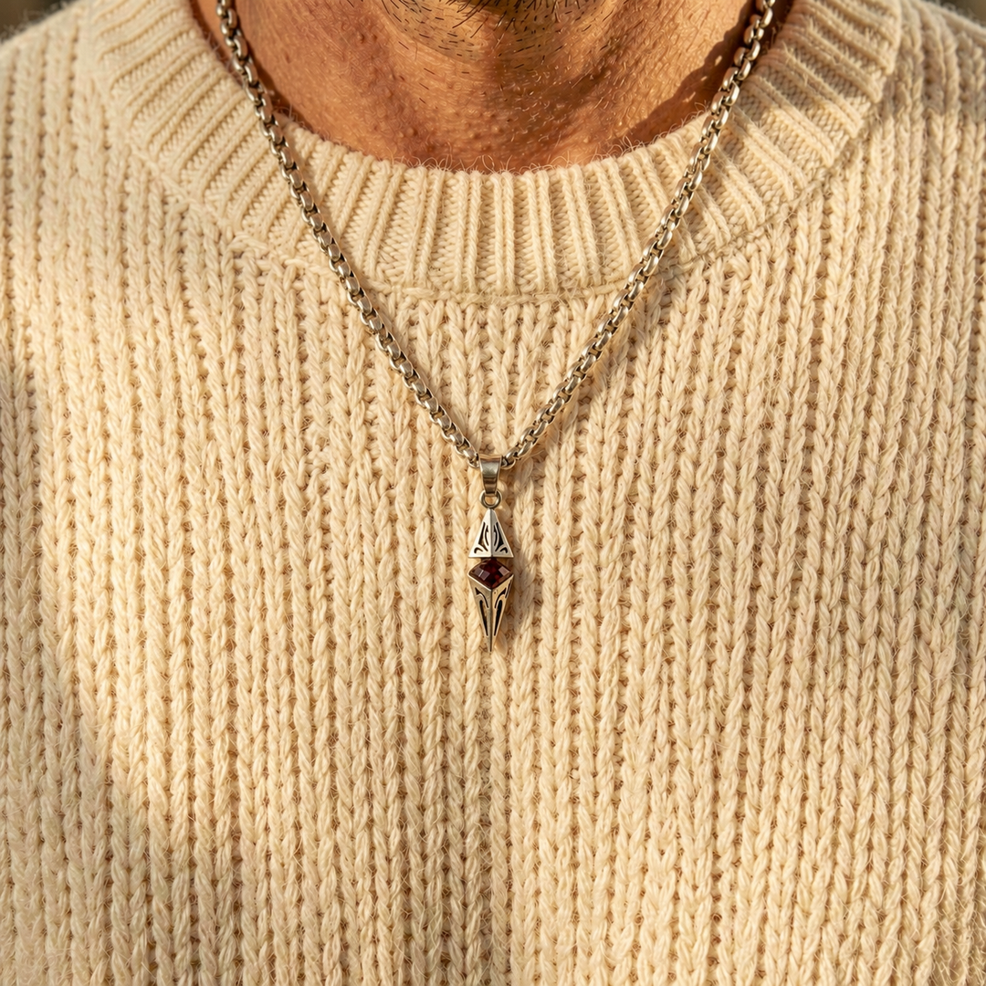 Axis Ruby necklace layered over a cream knit