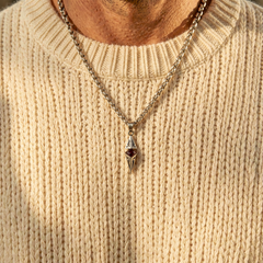 Axis Ruby necklace layered over a cream knit