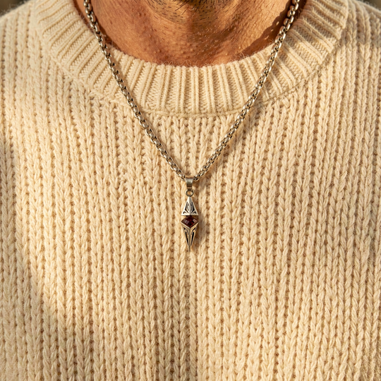 Axis Ruby necklace layered over a cream knit