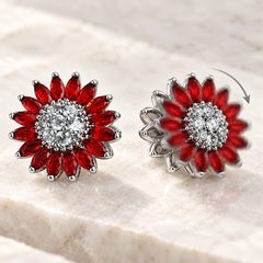 Bloom – motion scarlet silver – illustration of the manually turning flower face