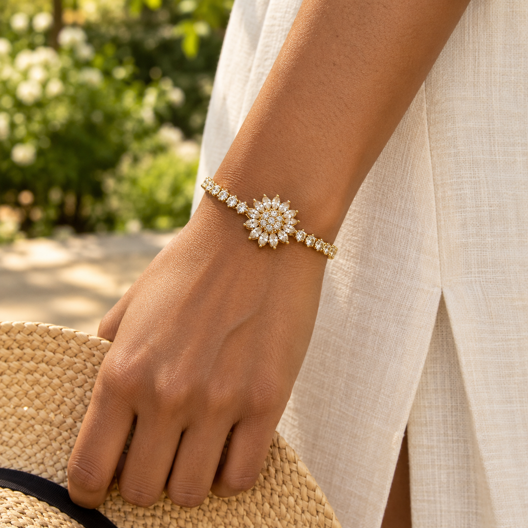 Blossom Gold bracelet worn outdoors with an ivory linen dress