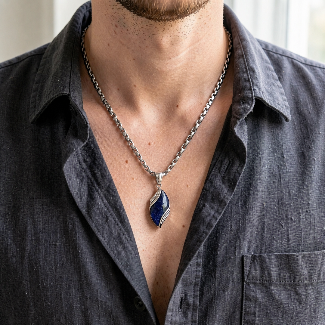 Nebula necklace worn with a charcoal open-collar shirt