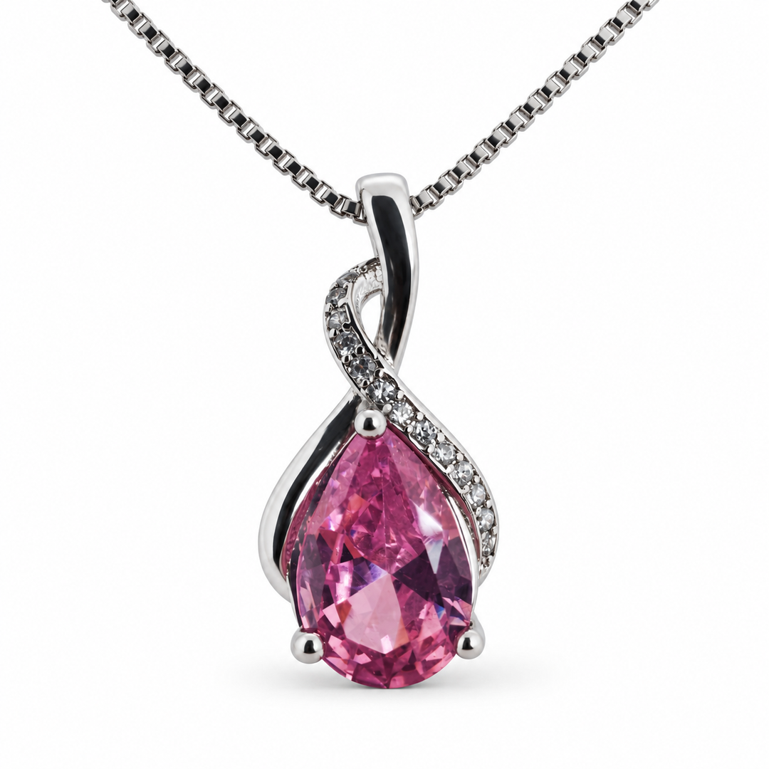 Drop blush necklace, showing the faceted pear-shaped centre and flowing silver setting on white