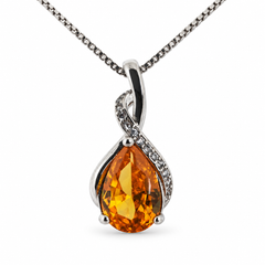 Drop honey necklace, showing the faceted pear-shaped centre and flowing silver setting on white