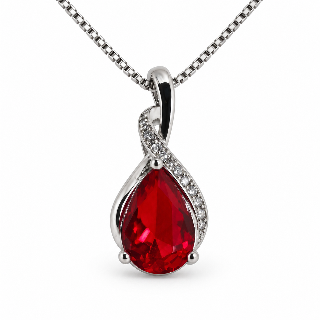 Drop Scarlet red pear-shaped necklace with a flowing silver setting, on white
