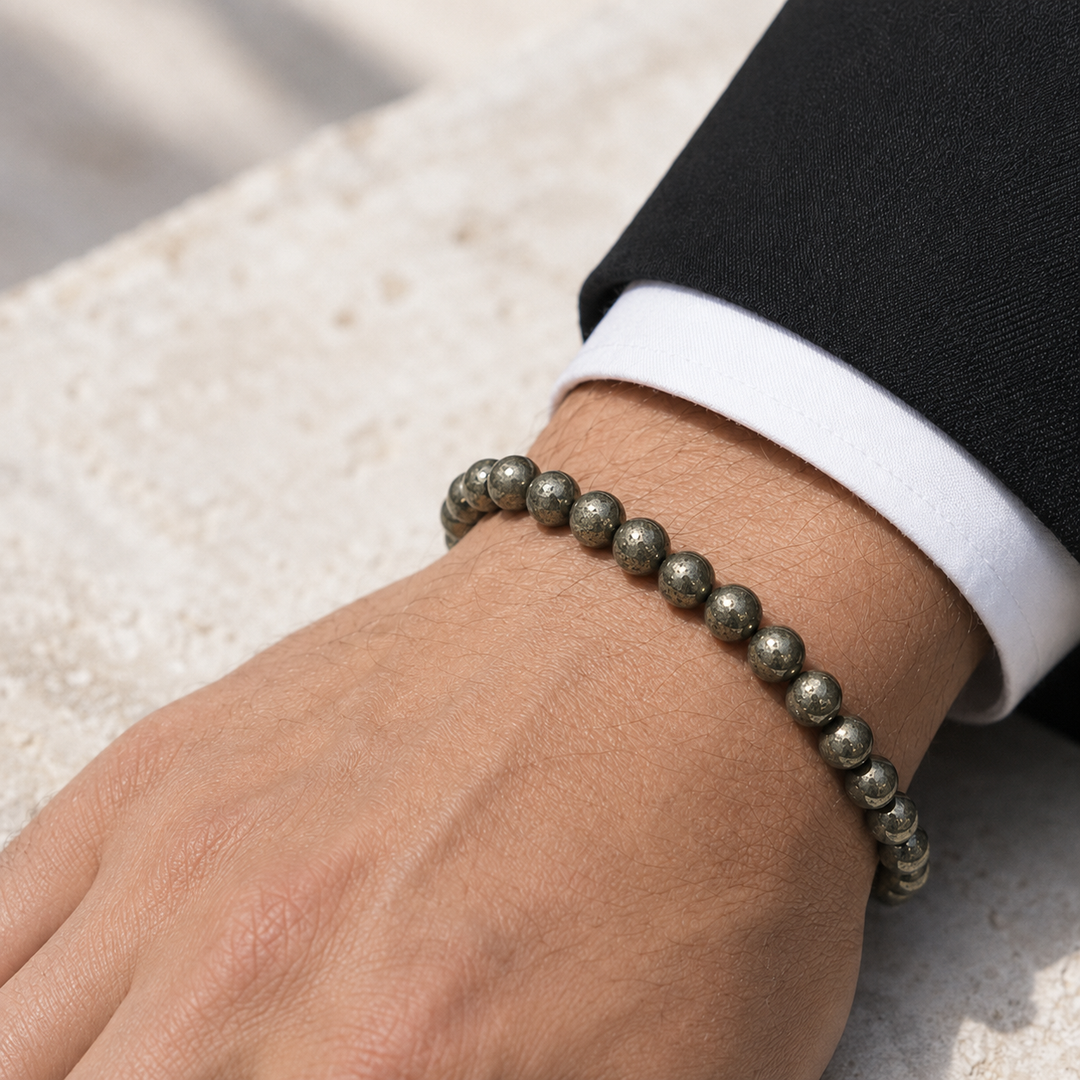 Vestige Mercury 8 mm pyrite bracelet worn with black tailoring