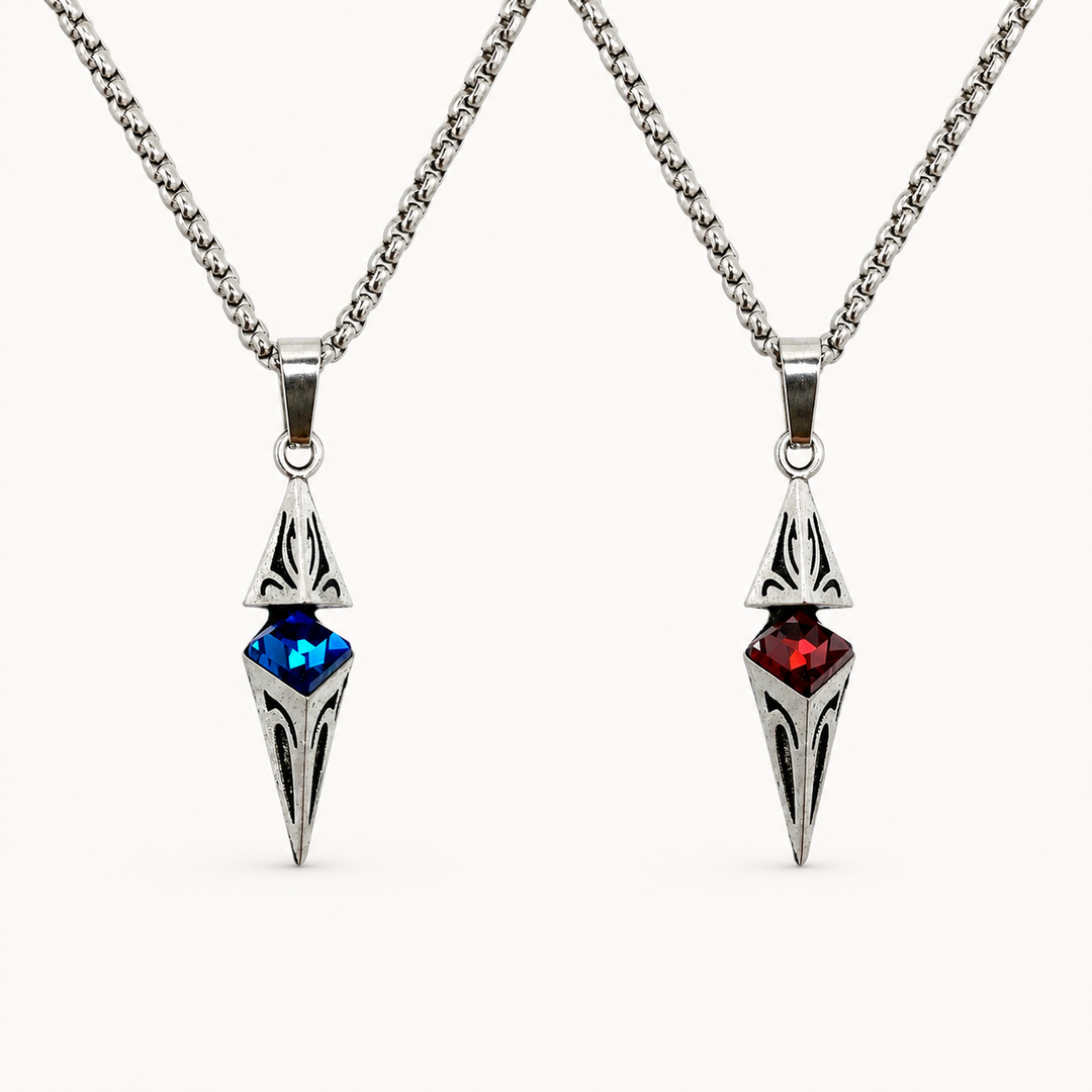 Axis necklaces in Cobalt blue and Ruby red finishes on a warm white background