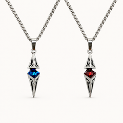 Axis necklaces in Cobalt blue and Ruby red finishes on a warm white background