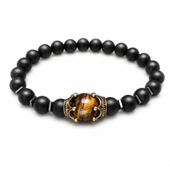 Crest Dusk matte-black bracelet with tiger-eye crown centre on white background