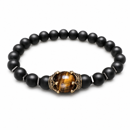 Crest Dusk matte-black bracelet with tiger-eye crown centre on white background