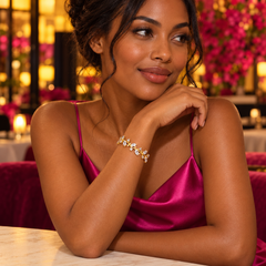 Eden in Clear with a gold-tone finish, worn with magenta satin for an evening look.