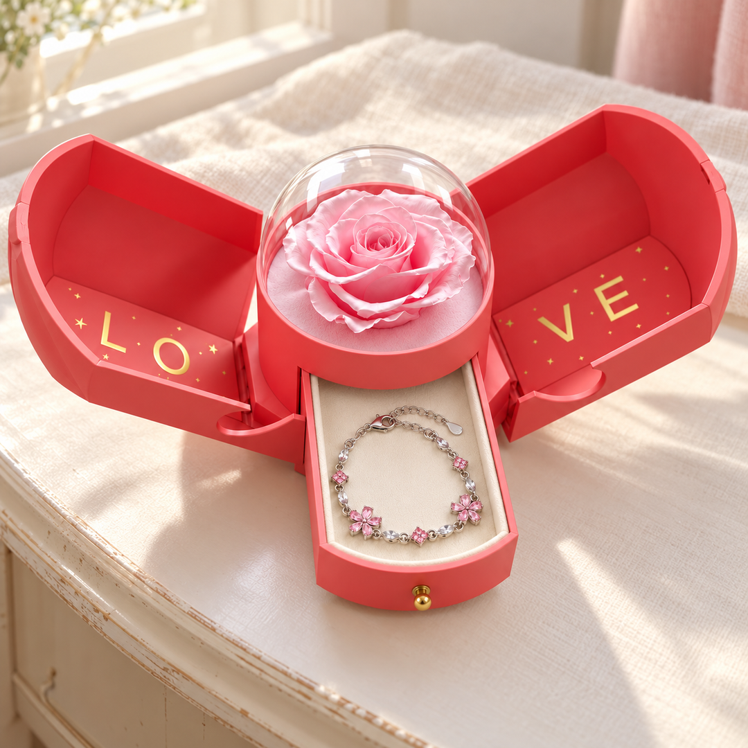 Floret in the open pink Rose Box on an ivory dressing table, with its clear dome over the rose