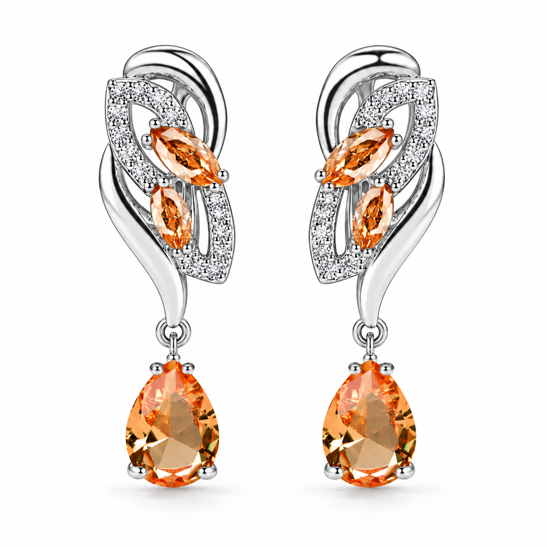 Iris Drop Earrings in Apricot, a matching pair with a silver leaf-inspired setting and faceted pear drops on white
