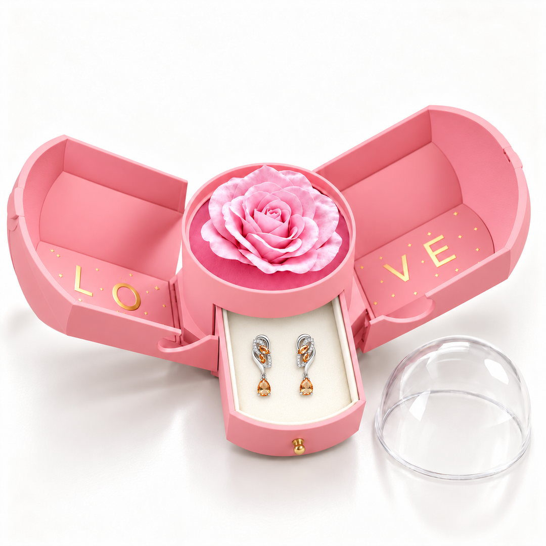 Iris Apricot Silver earrings, one pair in the open pink Rose Box drawer, with matching rose and clear dome alongside