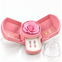 Iris Blush Silver earrings, one pair in the open pink Rose Box drawer, with matching rose and clear dome alongside