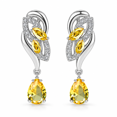 Iris Drop Earrings in Citron, a matching pair with a silver leaf-inspired setting and faceted pear drops on white
