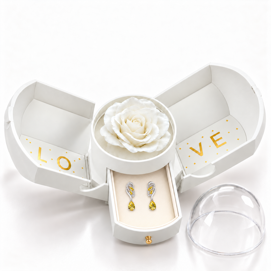 Iris Citron Silver earrings, one petite pair in the open white Rose Box drawer, with white rose and removable dome alongside