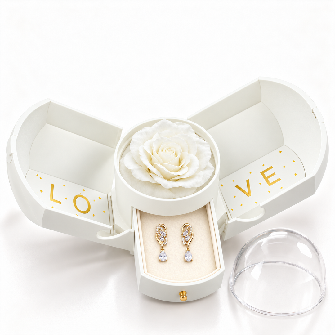 Iris Clear Gold earrings, one pair in the open white Rose Box drawer, with matching rose and clear dome alongside