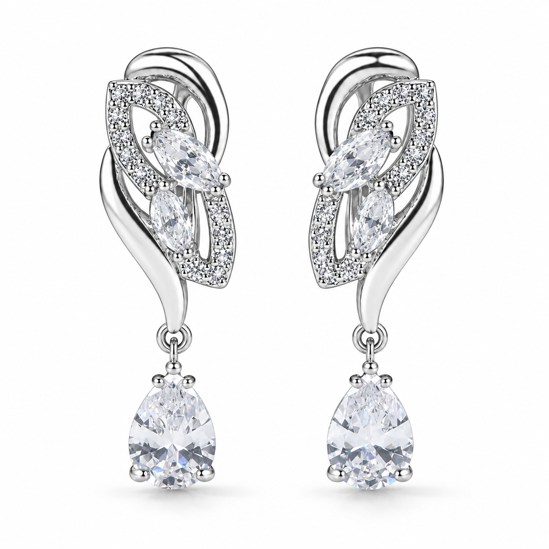 Iris Drop Earrings in Clear, a matching pair with a silver leaf-inspired setting and faceted pear drops on white