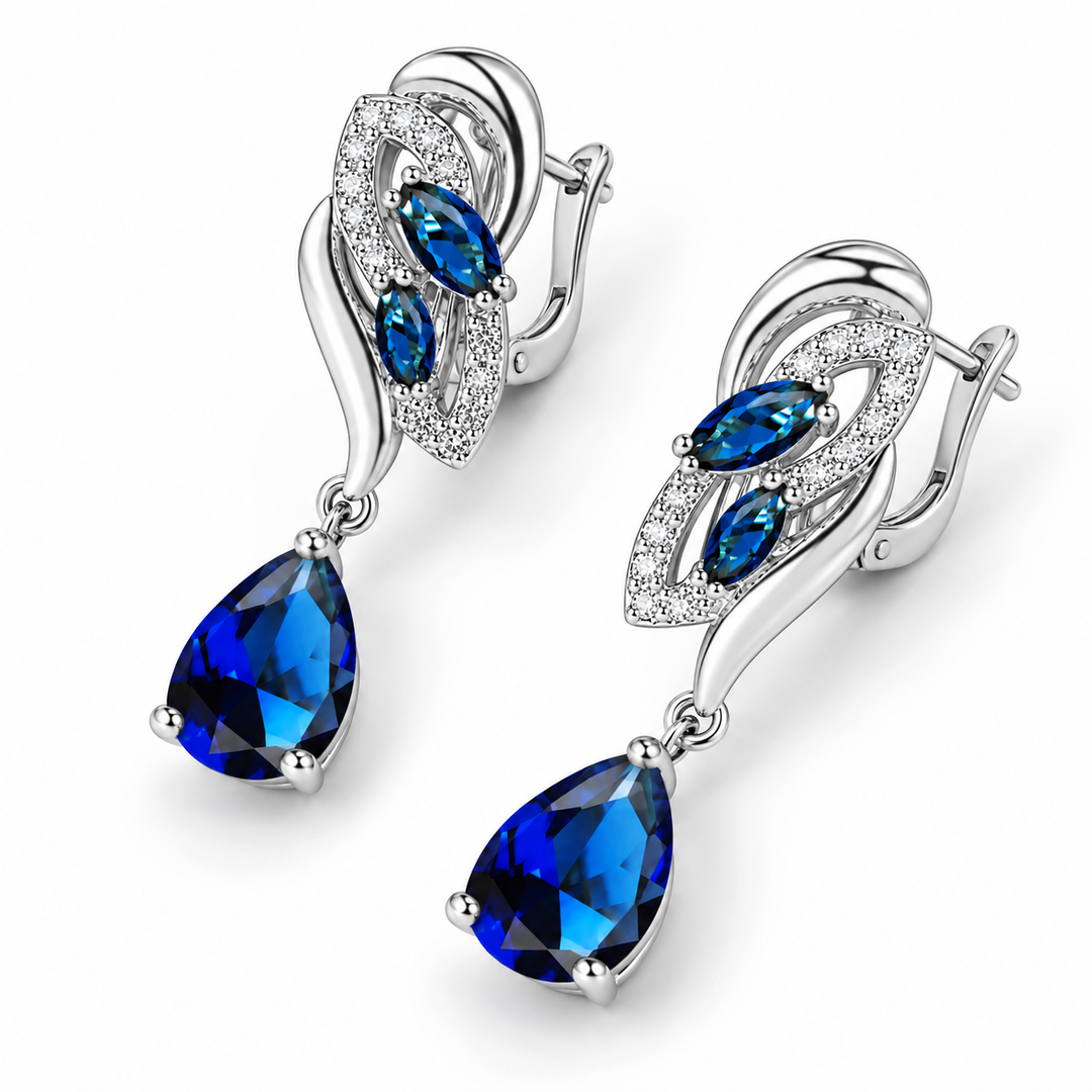 Iris Cobalt earrings at an alternate angle, showing the leaf settings, blue drops and hinged backs