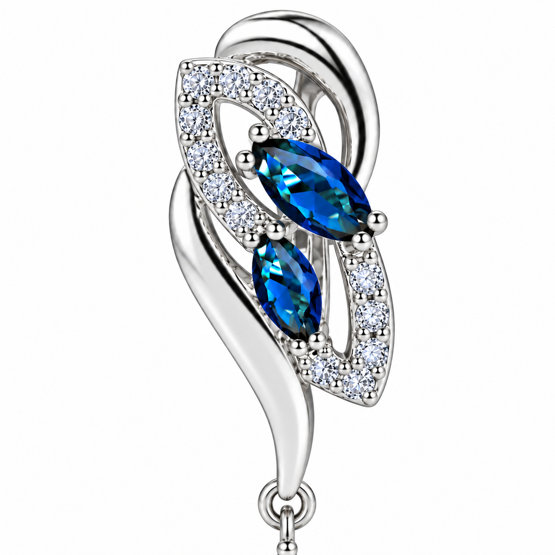 Close-up of the Iris Cobalt leaf setting, with two blue marquise stones and clear accents