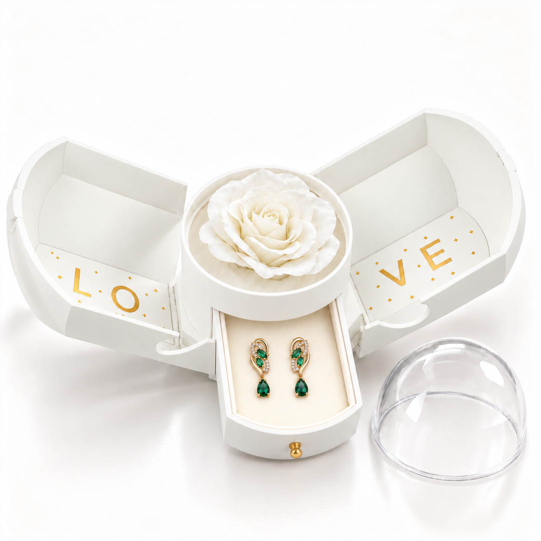 Iris Forest Gold earrings, one pair in the open white Rose Box drawer, with matching rose and clear dome alongside