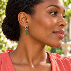 Iris Drop Earrings in Forest, worn on a pierced ear with the silver leaf setting and Forest pear-shaped drop visible