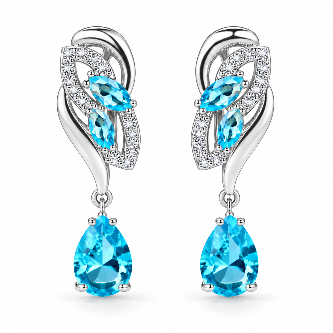 Iris Drop Earrings in Glacier, a matching pair with a silver leaf-inspired setting and faceted pear drops on white
