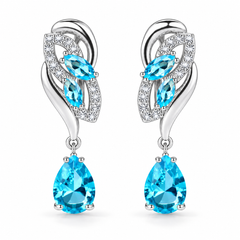 Iris Drop Earrings in Glacier, a matching pair with a silver leaf-inspired setting and faceted pear drops on white
