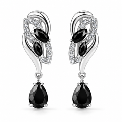 Iris Drop Earrings in Noir, a matching pair with a silver leaf-inspired setting and faceted pear drops on white