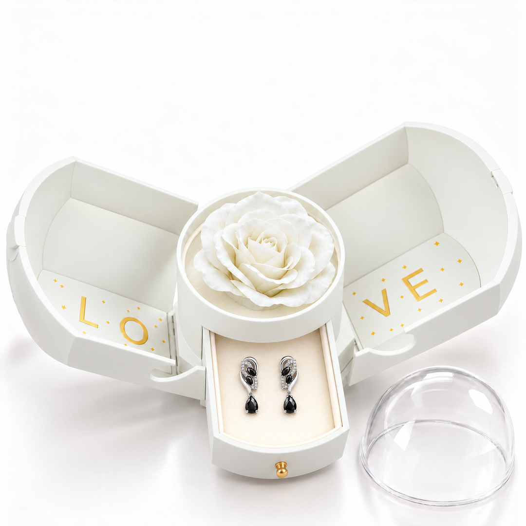Iris Noir Silver earrings, one pair in the open white Rose Box drawer, with the matching rose and clear dome alongside