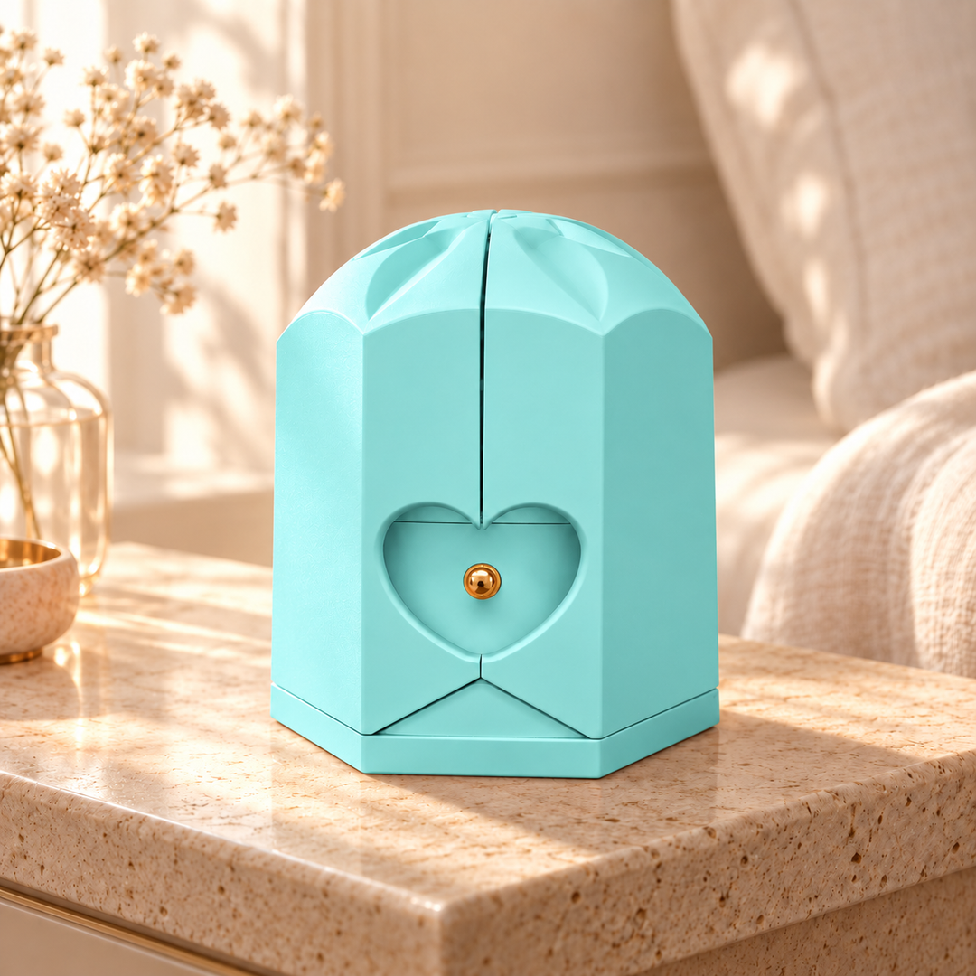Closed light blue Rose Box with sculpted crown and heart detail on pale stone