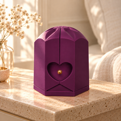 Closed purple Rose Box with sculpted crown and heart detail on pale stone