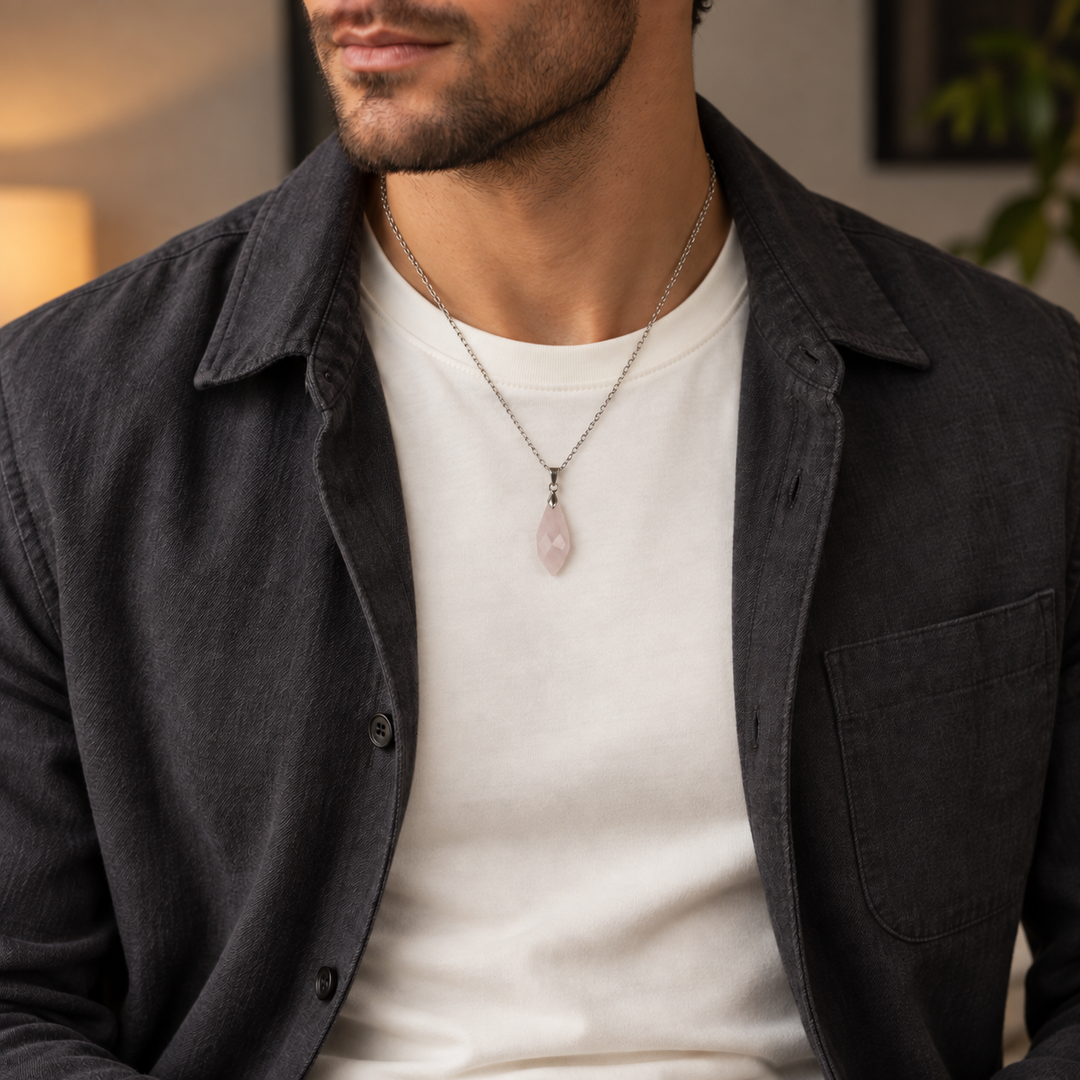 Meteor Blush necklace worn with an ivory tee with a charcoal jacket, showing its compact pendant and chain drop