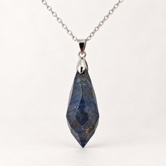 Meteor Cobalt faceted pendant, centred silver-tone fitting and fine chain on a light background