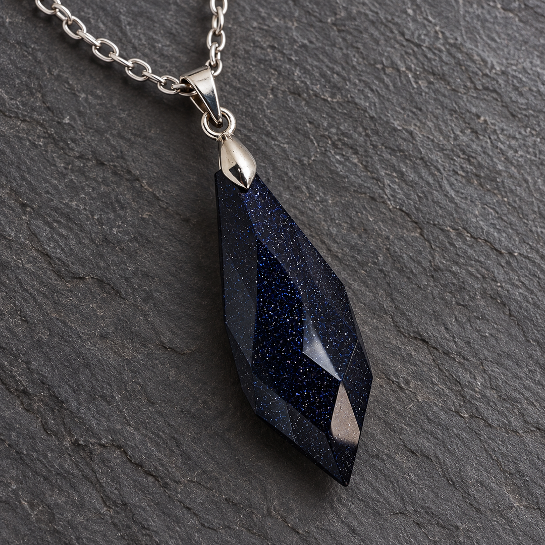 Meteor Midnight faceted pendant and centred silver-tone connection in close-up on dark slate