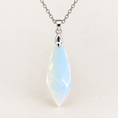 Meteor Opaline faceted pendant, centred silver-tone fitting and fine chain on a light background